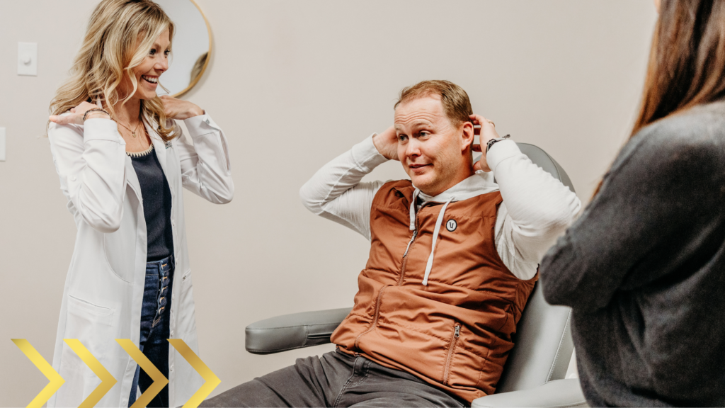 Transcend provider demonstrating shoulder pain posture during consultation