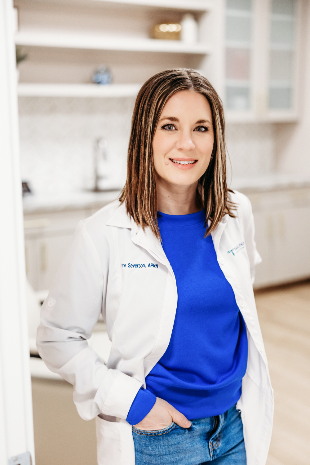 Kyrie Severson, APRN, AQH, co-founder of Transcend Headache Clinic, smiling in the clinic.