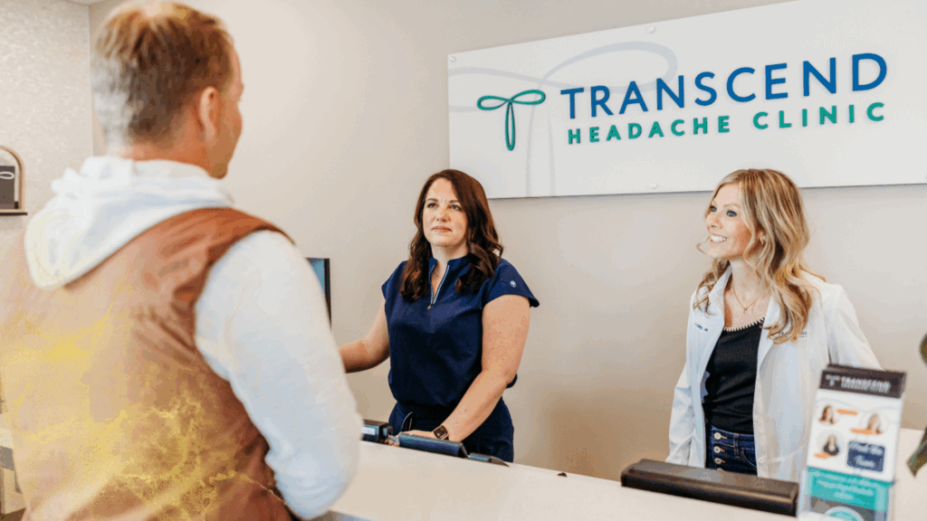 Transcend Headache Clinic staff welcoming a patient at the front desk in West Fargo, ND