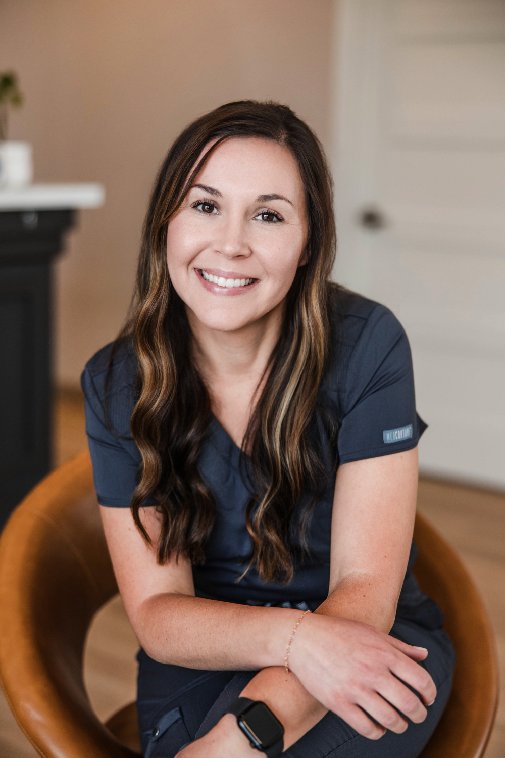Tasha Skalicky, RN, clinic nurse at Transcend Headache Clinic, smiling inside the clinic.