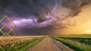 Dramatic storm cloud with lightning over a rural North Dakota road, representing summer weather headache triggers at Transcend Headache Clinic.