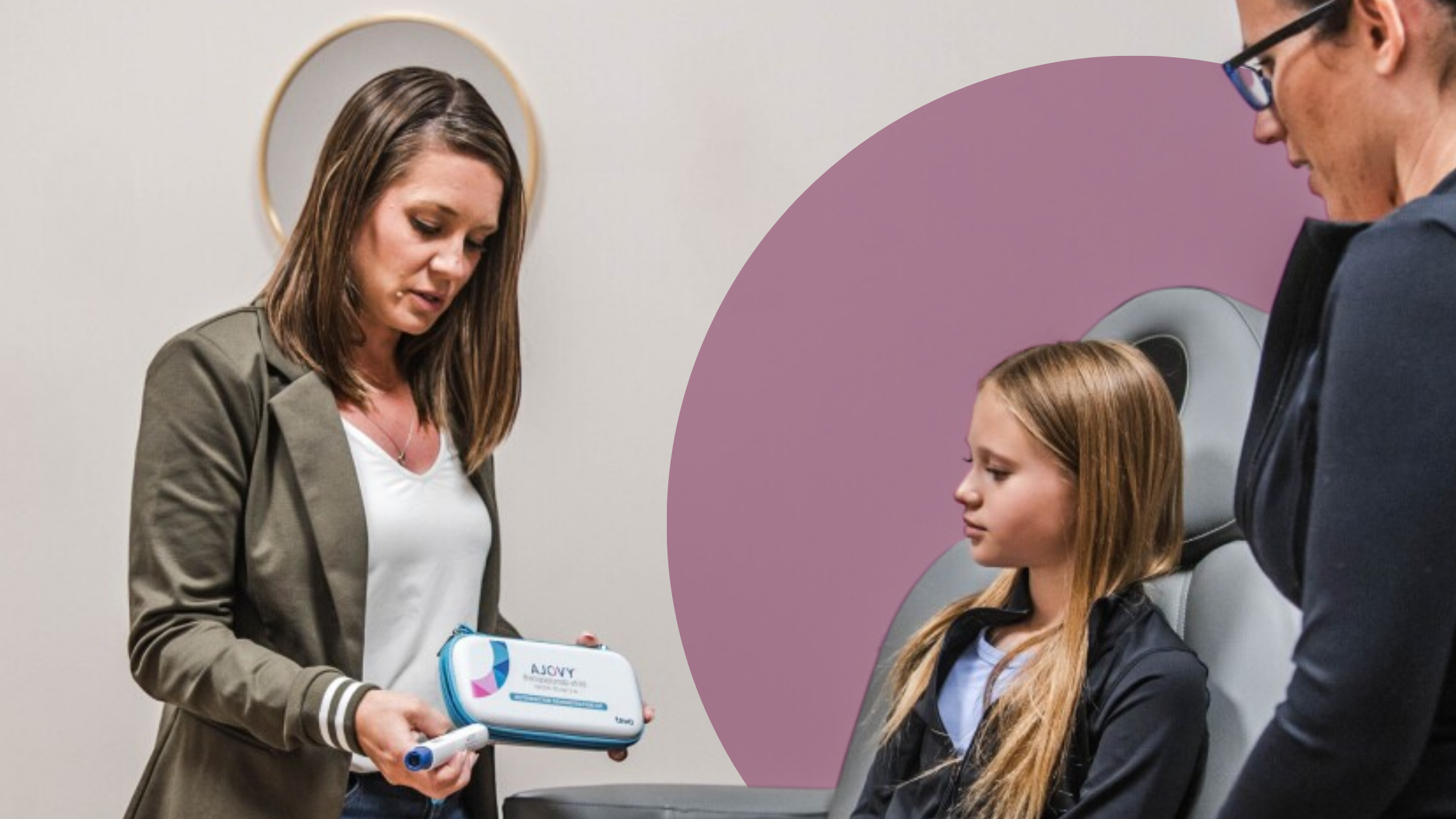 Provider showing a migraine treatment injector to a young patient and parent during a consultation at Transcend Headache Clinic.