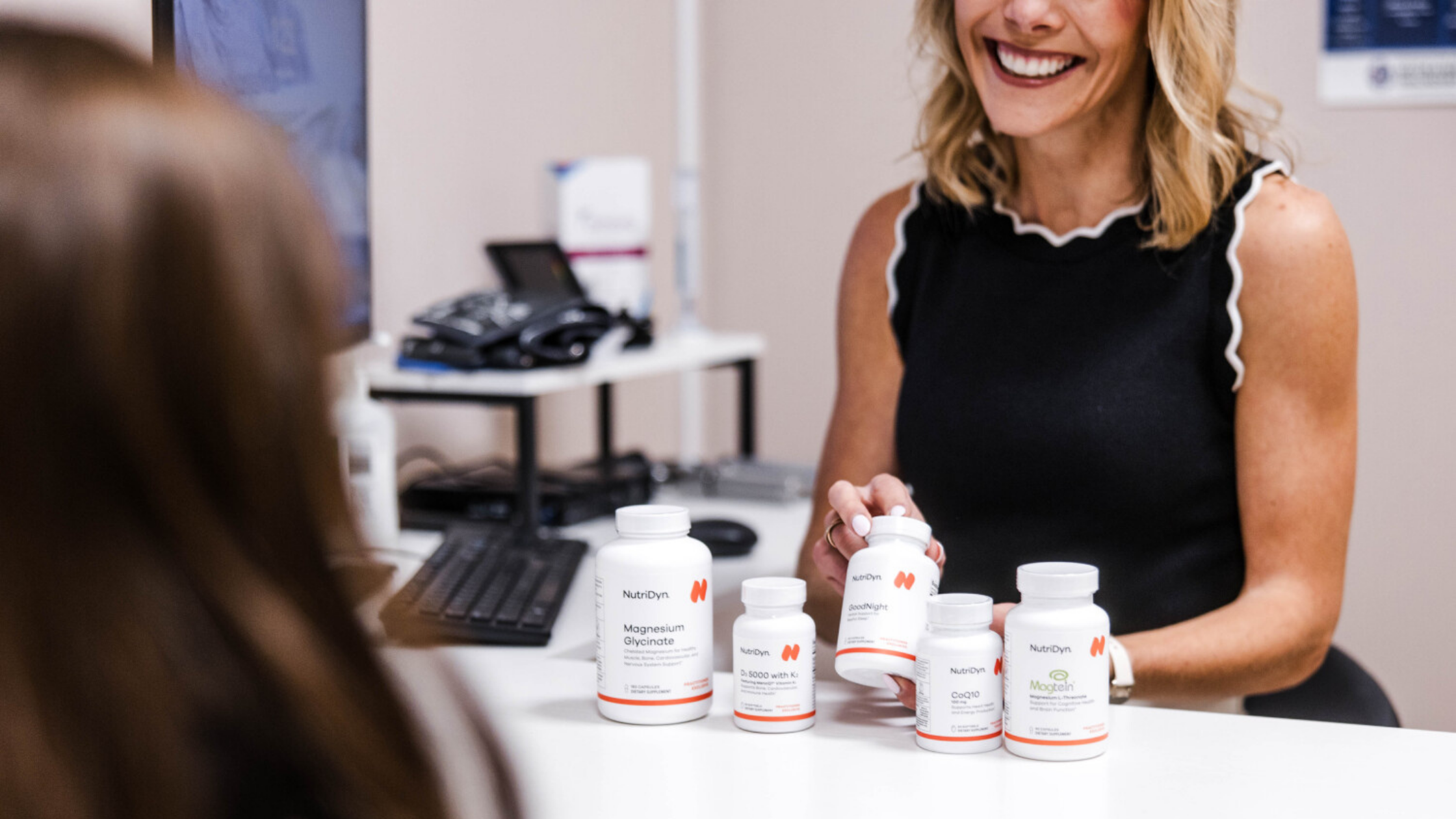 Provider and patient at Transcend Headache Clinic discussing magnesium and supplement options for headache and migraine prevention.